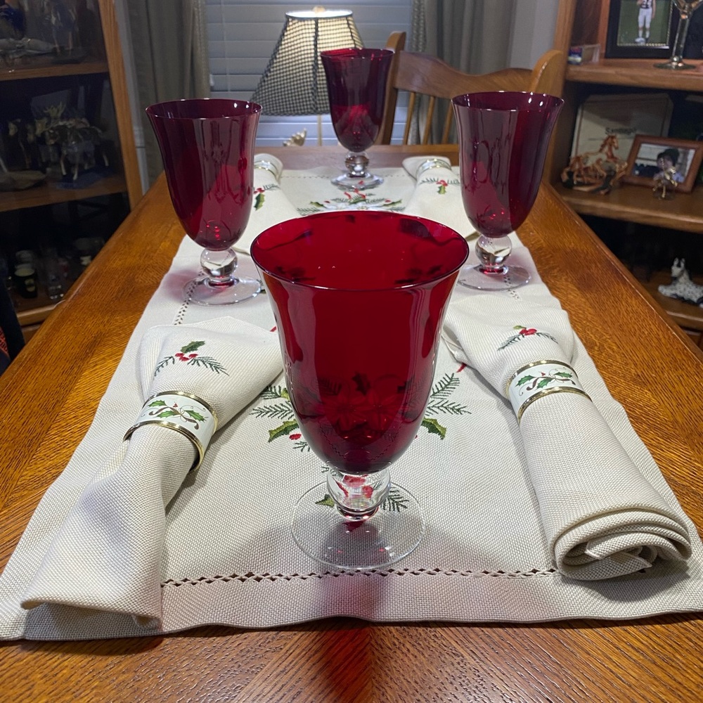 Christmas table runner with matching napkins and napkin rings and goblets